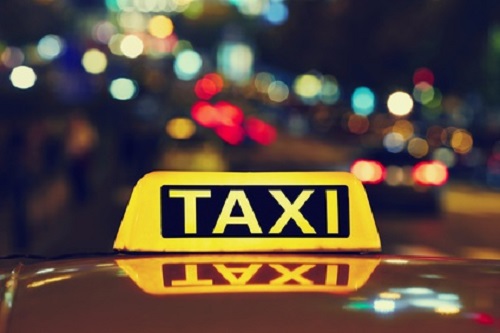Taxi car on the street at night